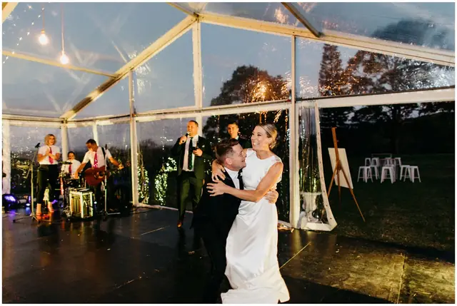 Ella & Jackson at The Woods: The couple dance outside the illuminated marquee.