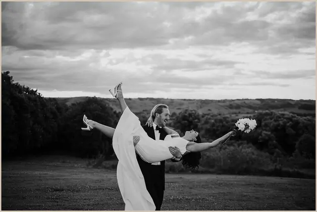 Jess & Rich at The Orchard Estate: The bride turns with her veil and bouquet in the breeze.