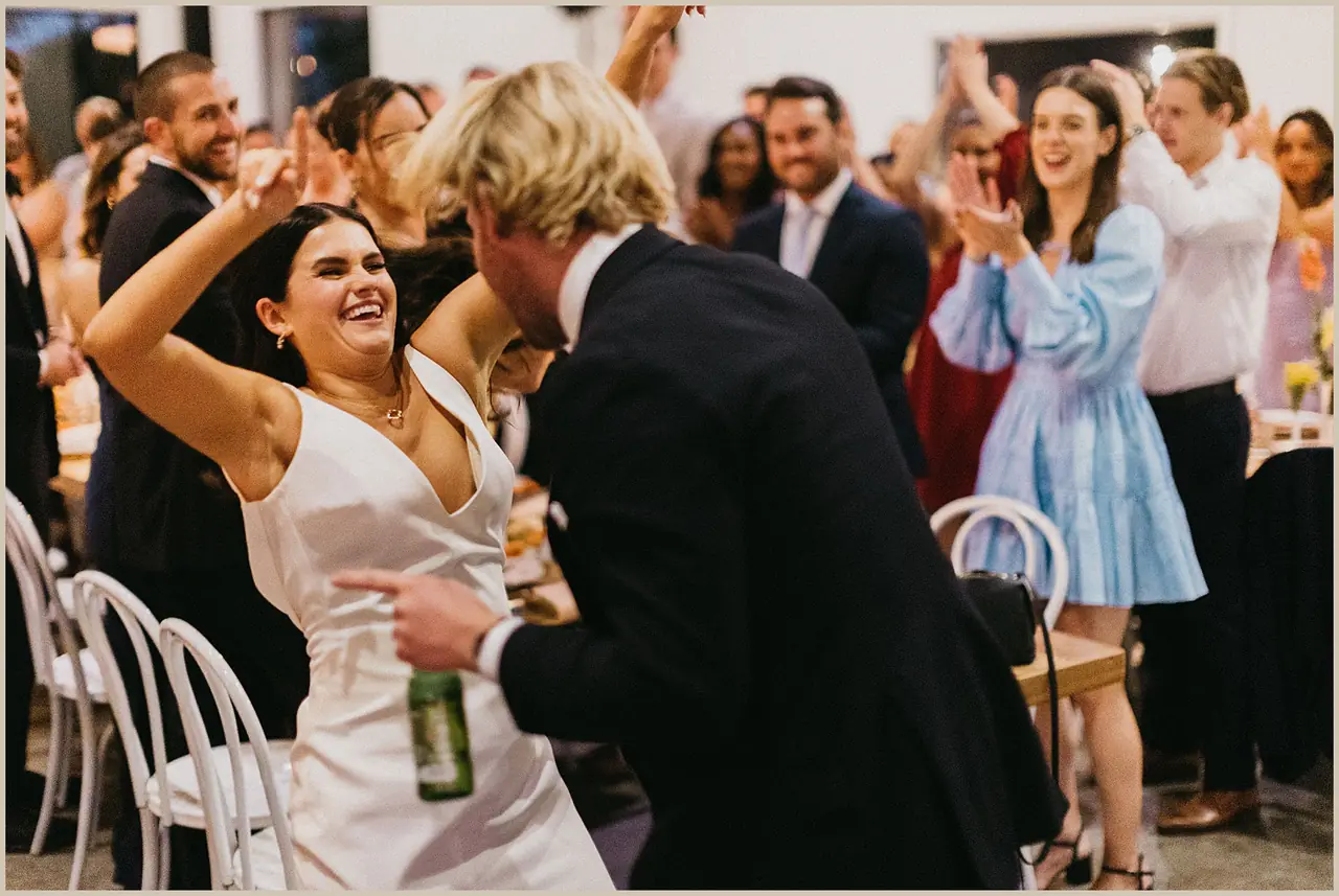 Jess & Rich at The Orchard Estate: The couple celebrate with smiling guests at the reception.