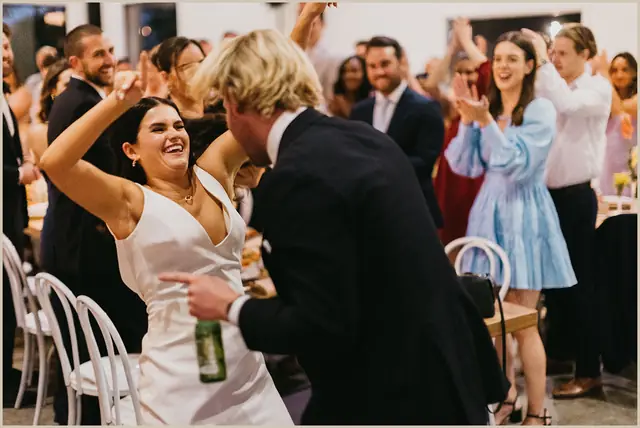 Jess & Rich at The Orchard Estate: The couple celebrate with smiling guests at the reception.