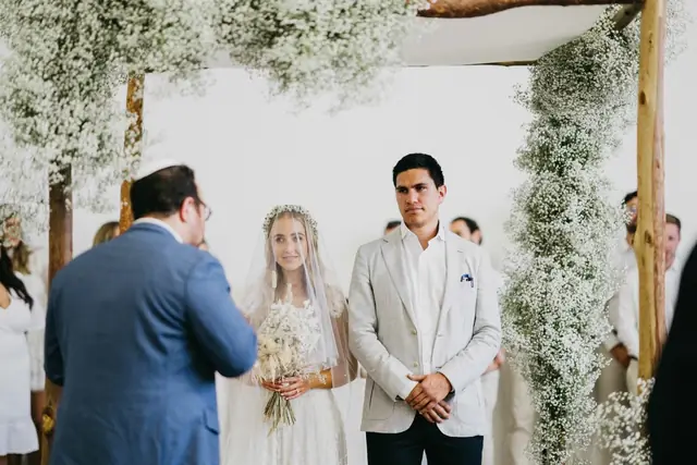 Tali & Jesse at Three Blue Ducks: The couple stand beneath the chuppah during the ceremony.